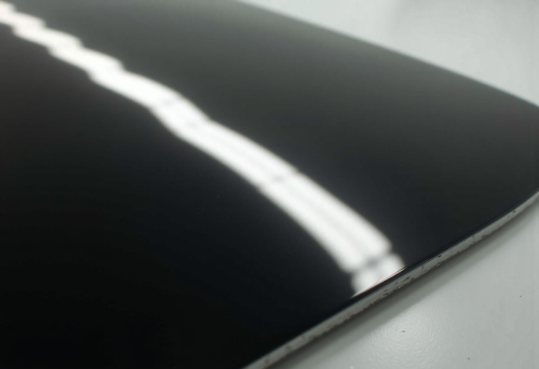 Light bar across a black panel edge